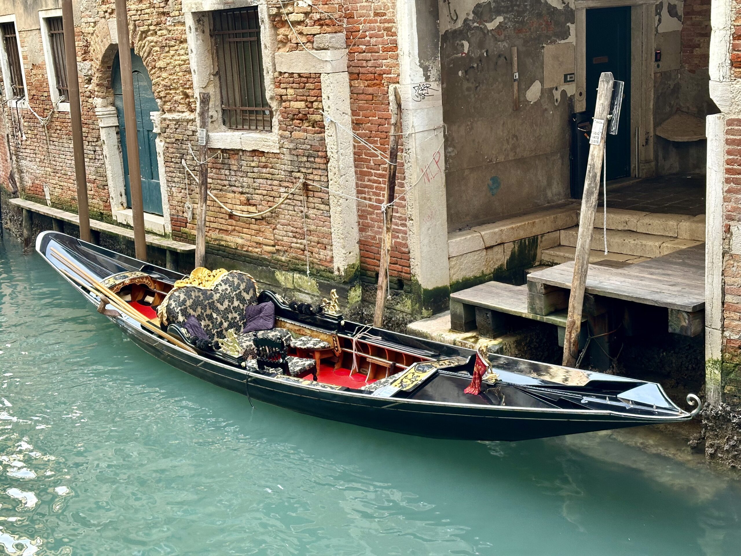 Traditional venetian boat along a canal